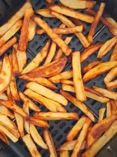 French fries in an air fryer basket