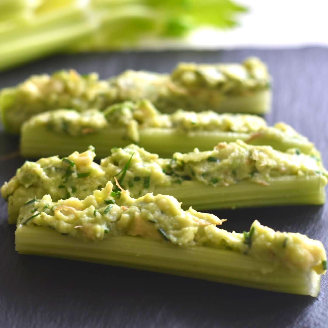 Close up look of Celery Sticks stuffed with avocado mixture