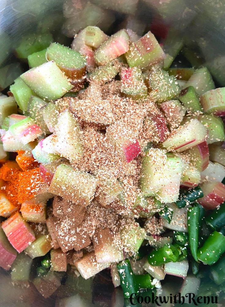 Adding of green chilies and spice