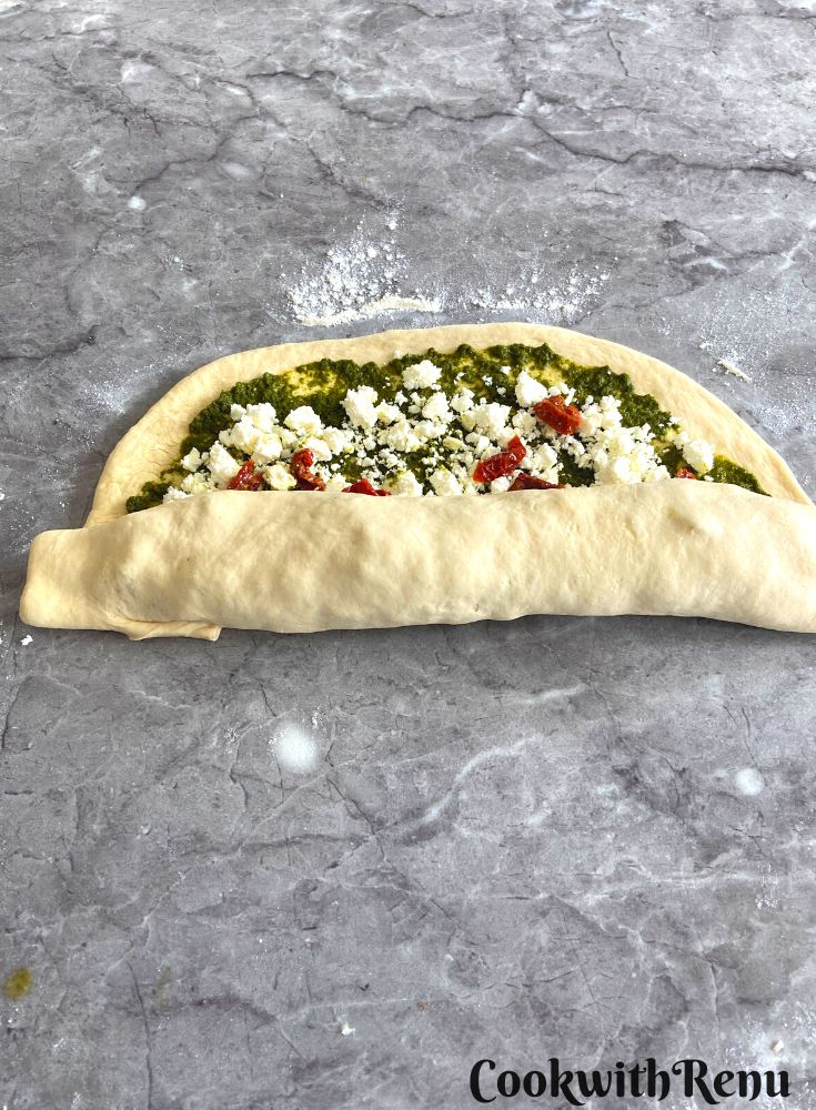Rolling dough into the shape of log