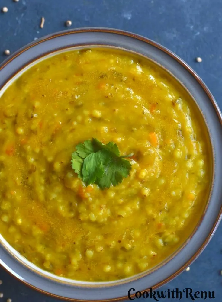 Millet and dal Khichdi served in a grey bowl