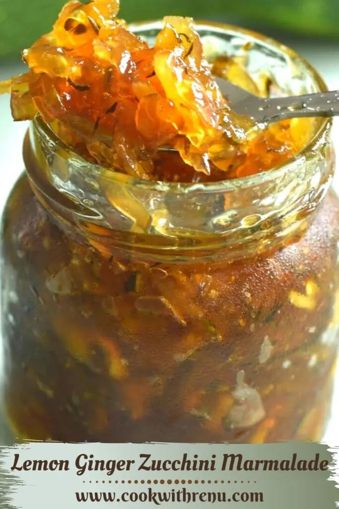 Lemon Ginger Zucchini Marmalade presented in a glass jar, with a close up look of jelly in a spoon