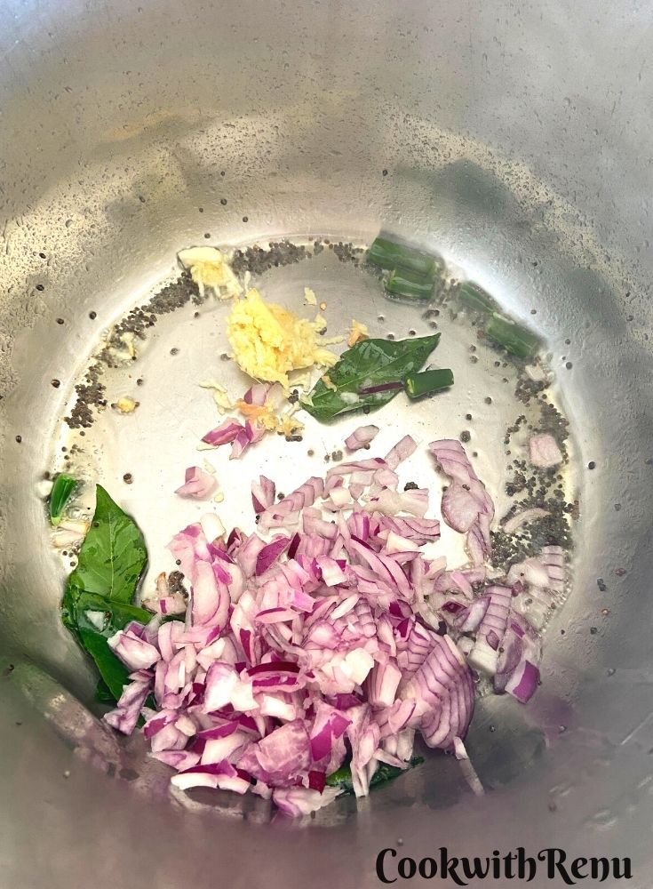 Onion and curry leaves in oil