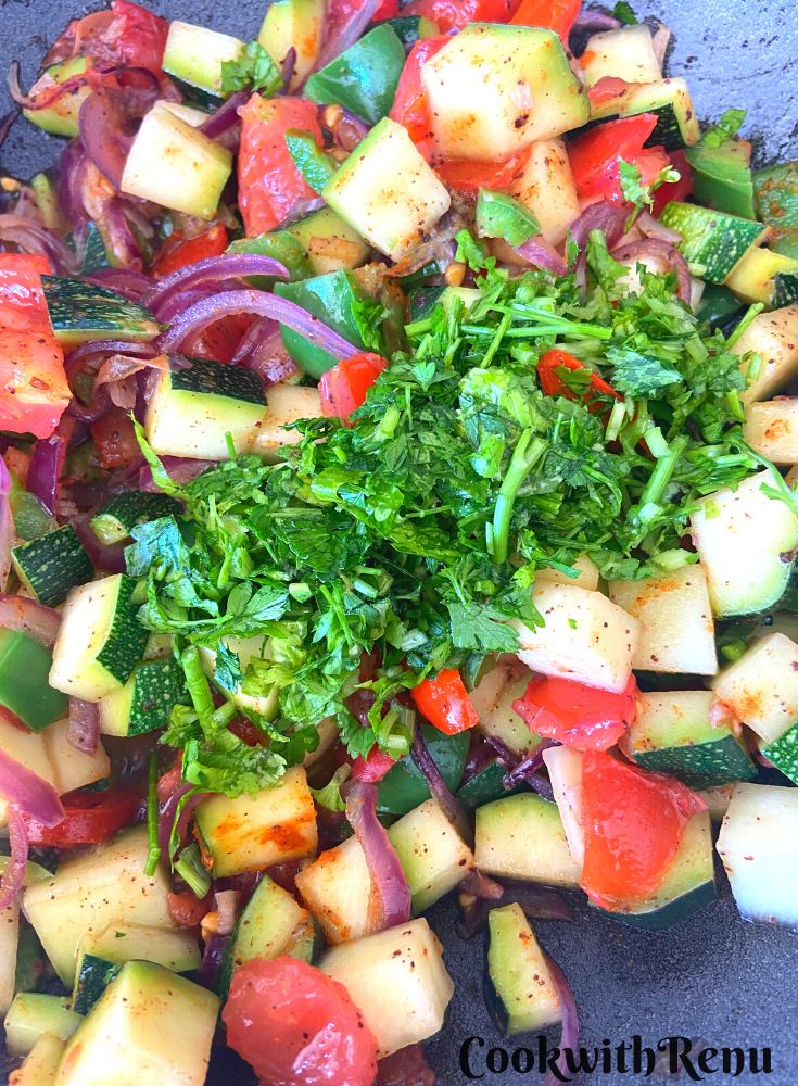 Adding Parsley and Coriander to the veggies