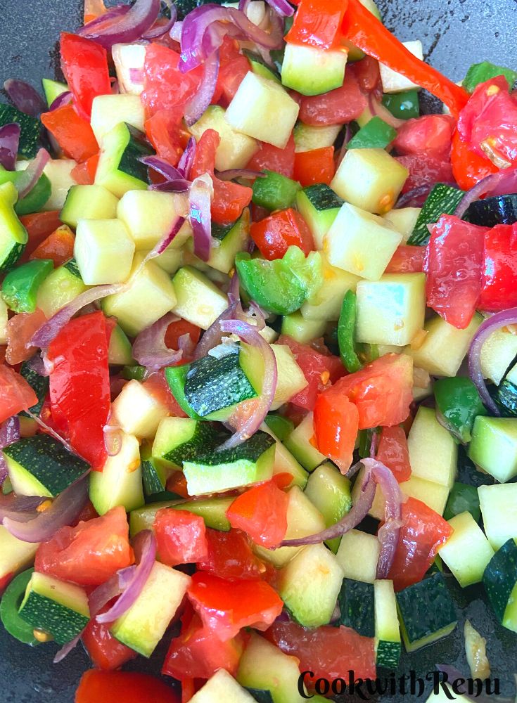 Adding Tomatoes and mixing with veggies