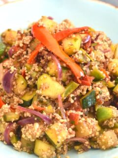 Couscous with Spiced Zucchini served in a wide blue bowl