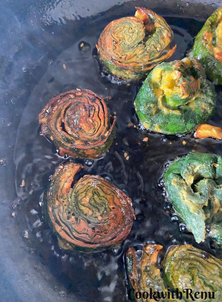 Shallow Frying the Patra in a cast iron pan.