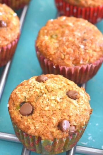 Zucchini Coconut Lemon Muffins arranged on a wire rack.