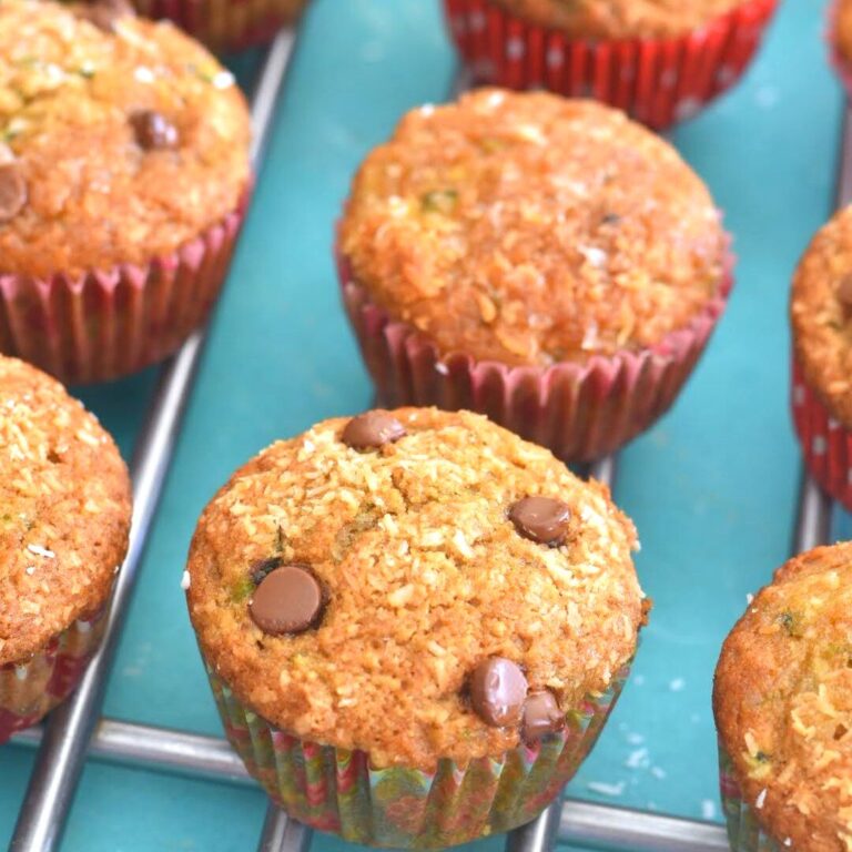 Zucchini Coconut Lemon Muffins arranged on a wire rack.