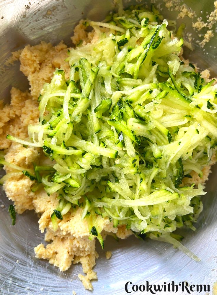 Adding Zucchini to batter.
