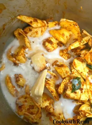 Adding of coconut milk to curry
