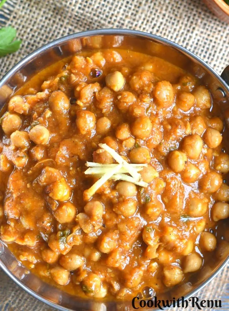 Top view of Chole served in a kadai or a wok.