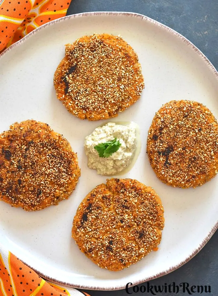 Pumpkin Sweet Potato and Amaranth Patties served on a white plate with some chutney.