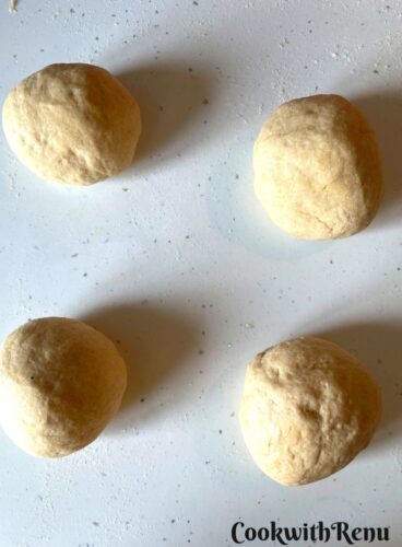 Dividing the dough into equal size portions.