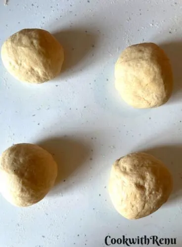 Dividing the dough into equal size portions.