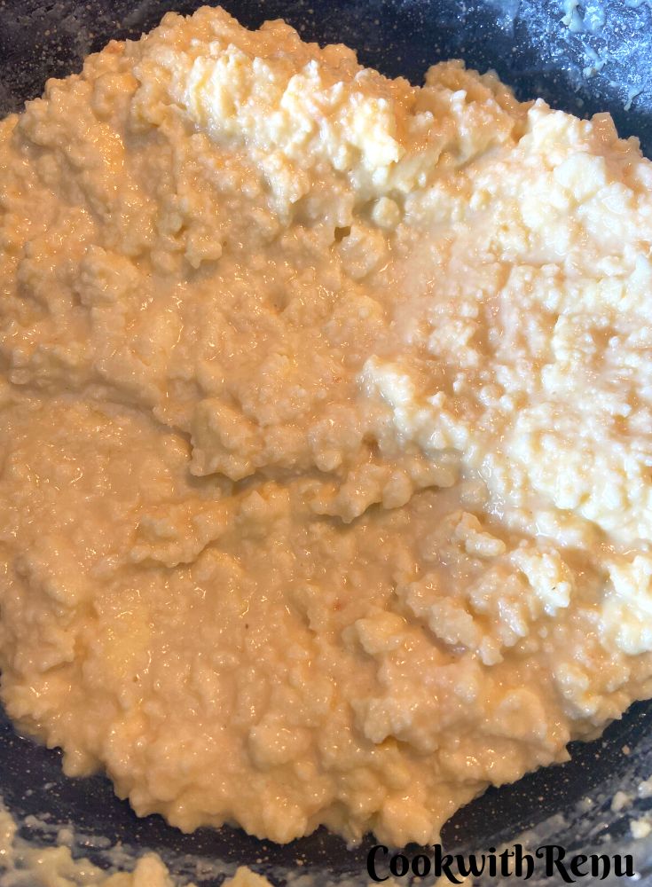 Kalakand Mixture almost cooked in a wok.