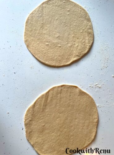 Rolling of the bread into circular disc.