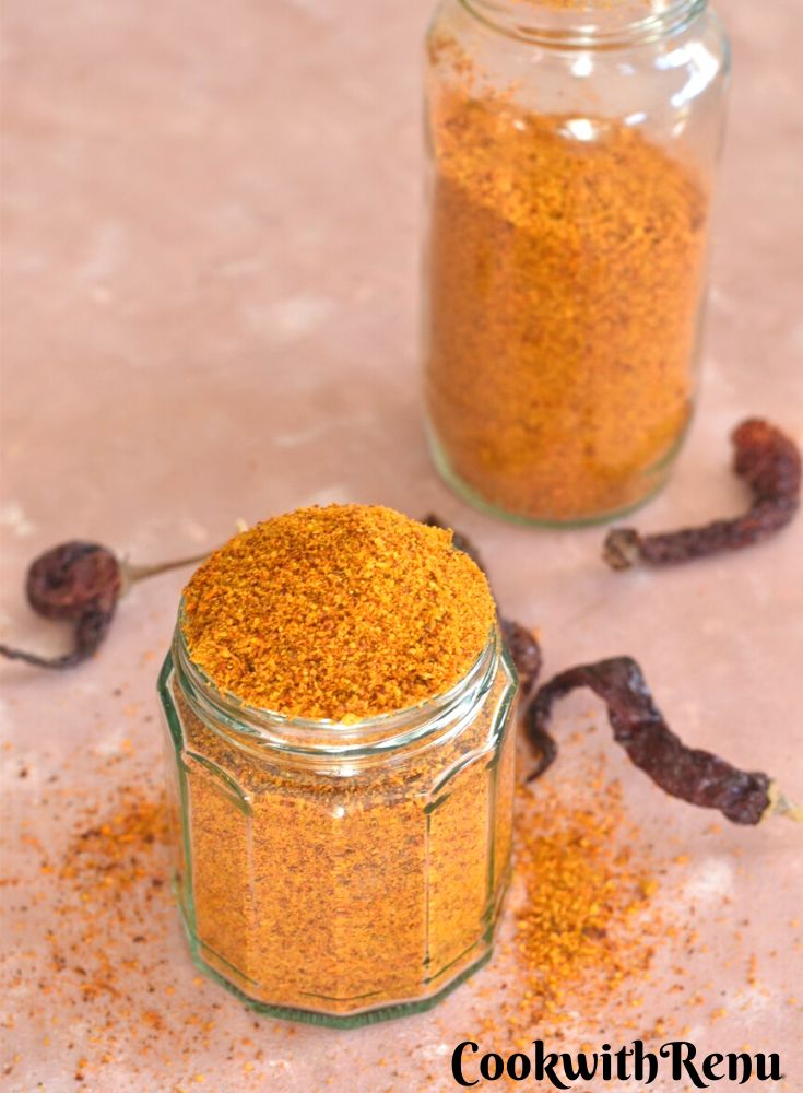 Gun powder in 2 glass jar with some chilies and some powder lying around
