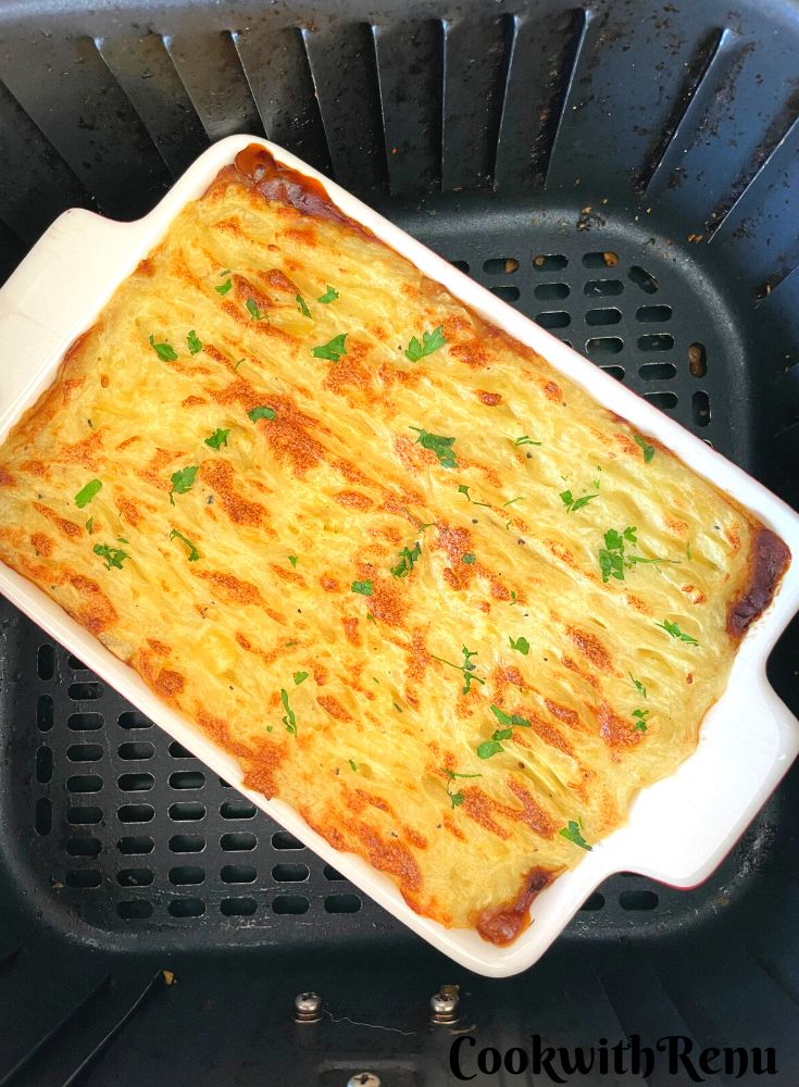 Meatless Shepherds pie baked in air fryer and seen in an air fryer basket.