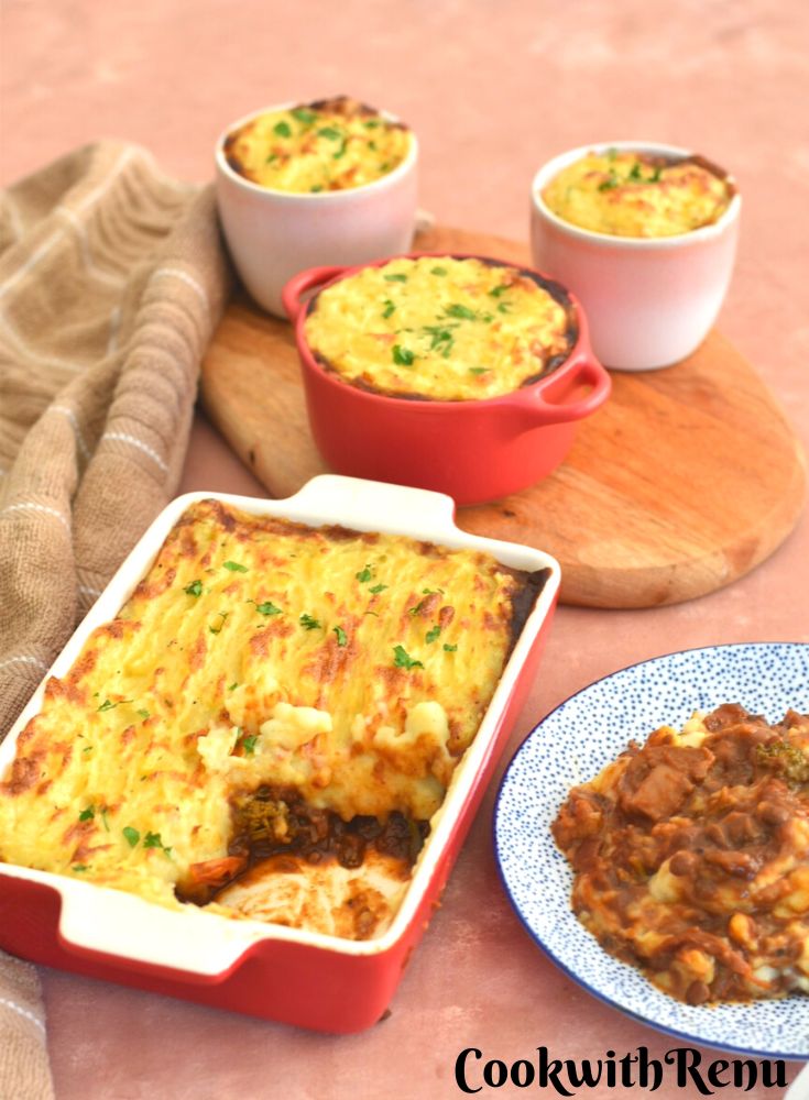 Vegan Shepherds pie in a rectangular baking tray and individual ramekin molds. Also served in a blue dotted plate.
