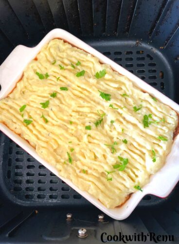Vegan Shepherdless Pie in a rectangular tray ready to be baked in an air fryer.