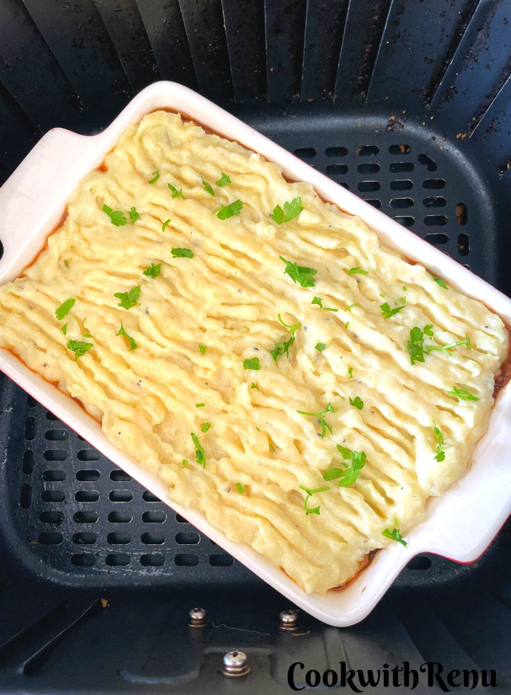 Vegan Shepherdless Pie in a rectangular tray ready to be baked in an air fryer.