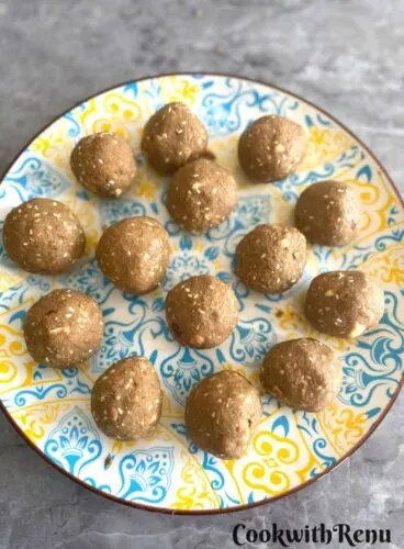 Gluten-free Bajra ladoo served in a Blue and yellow plate.