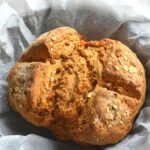 Irish Brown Soda Bread on white parchment paper.