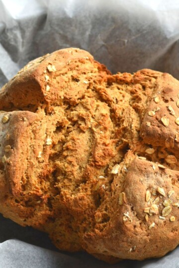Irish Brown Soda Bread on white parchment paper.