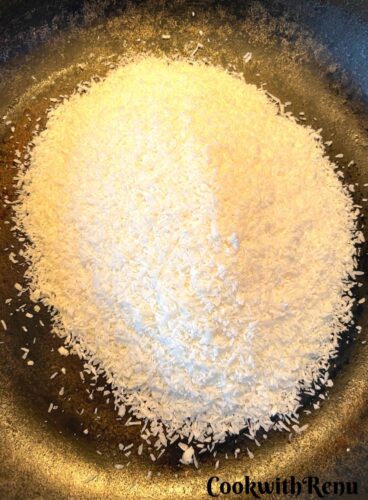 Roasting of Desiccated coconut in a cast iron pan.