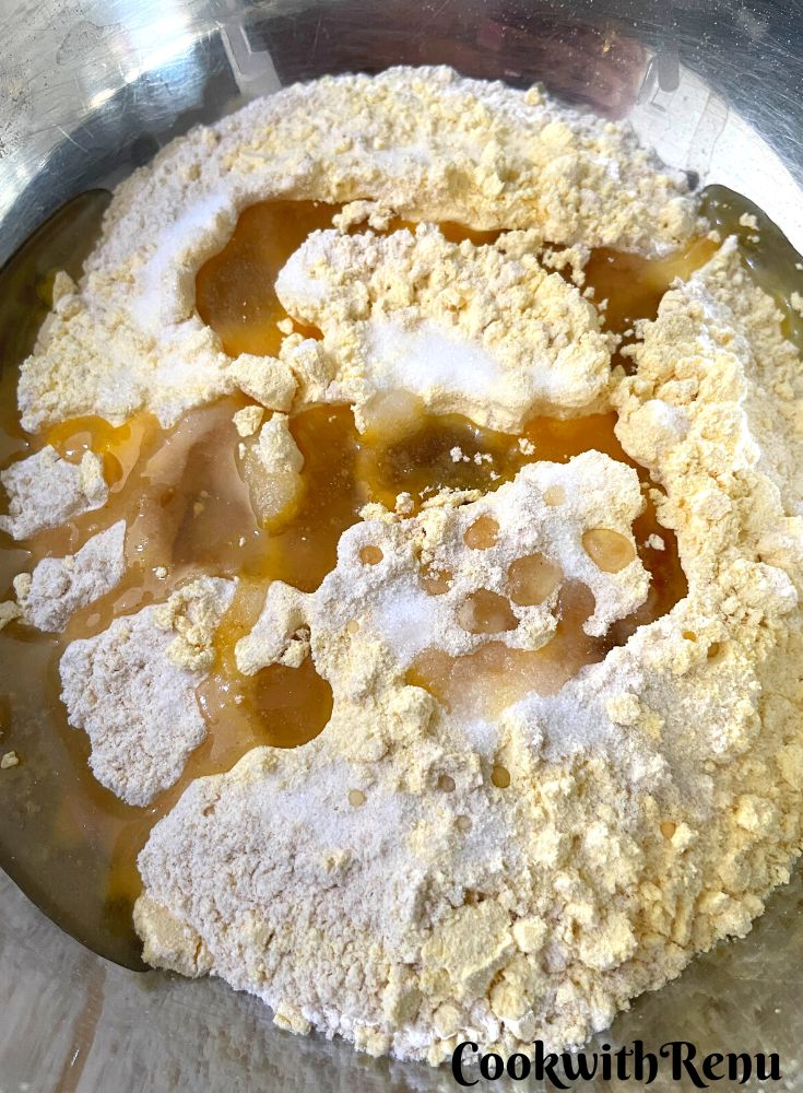 Oil added to dough in a bowl.