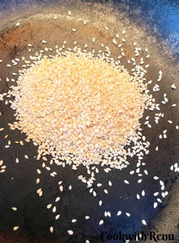 Roasting Sesame Seeds in a cast iron pan.
