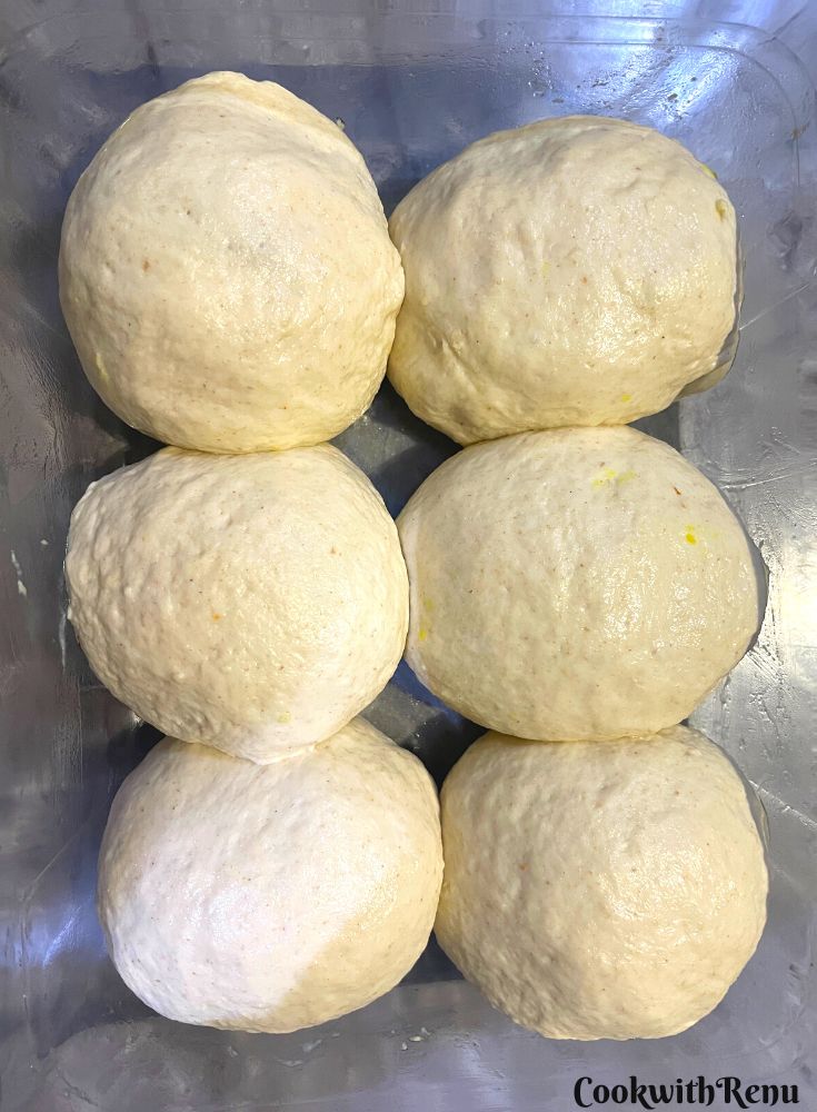 Vada Pav getting proofed in a baking tray.