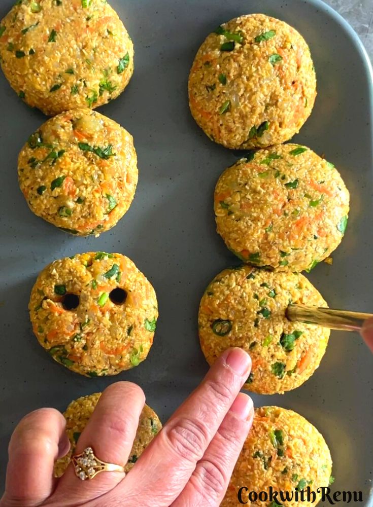 Adding eyes to the smiley using a spoon.