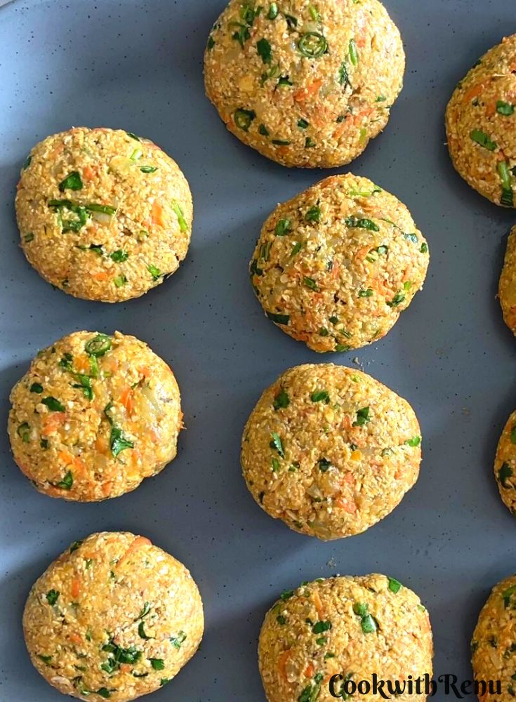 The mixture is shaped into a patty and kept on a grey plate.