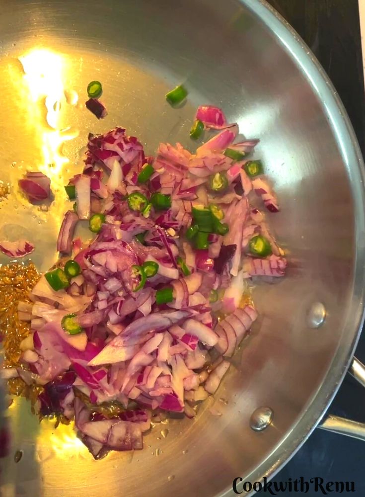 Onion and green chilies added to oil.