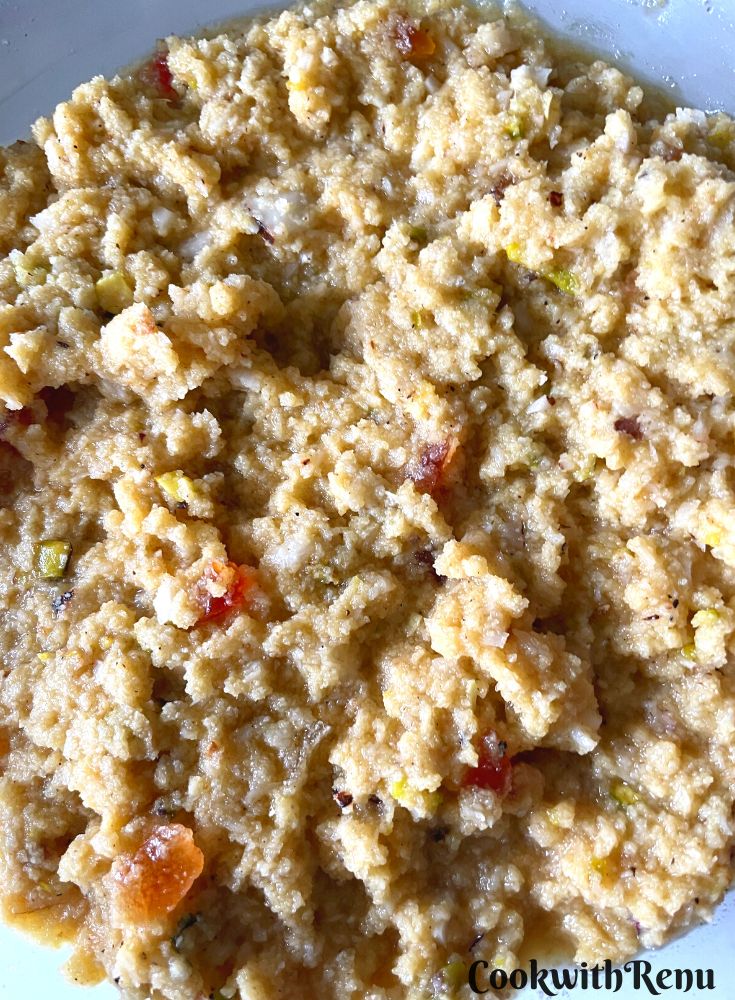 Ready Semolina coconut batter with papaya and nuts.