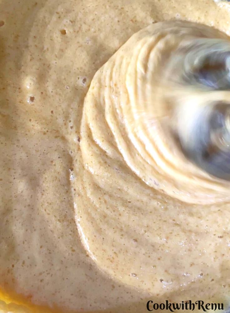 Sugar, Eggs, and Butter mixed in a bowl.