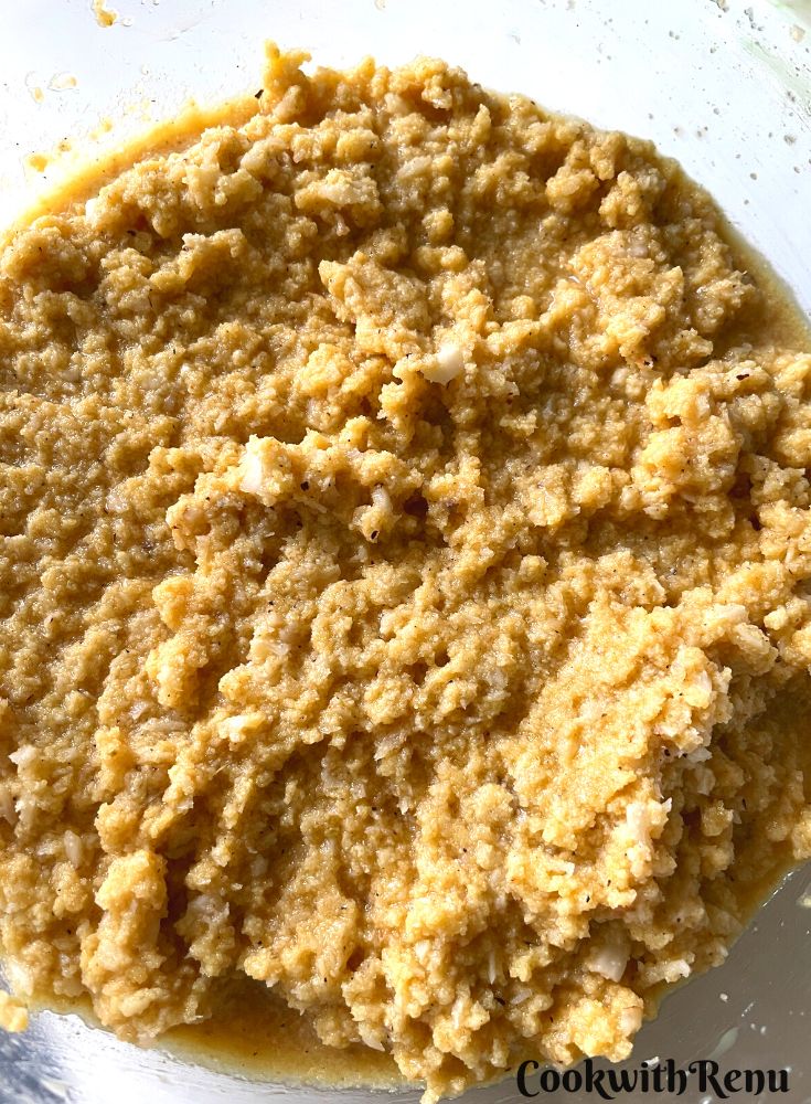 The ready Coconut and rawa cake batter in a bowl.