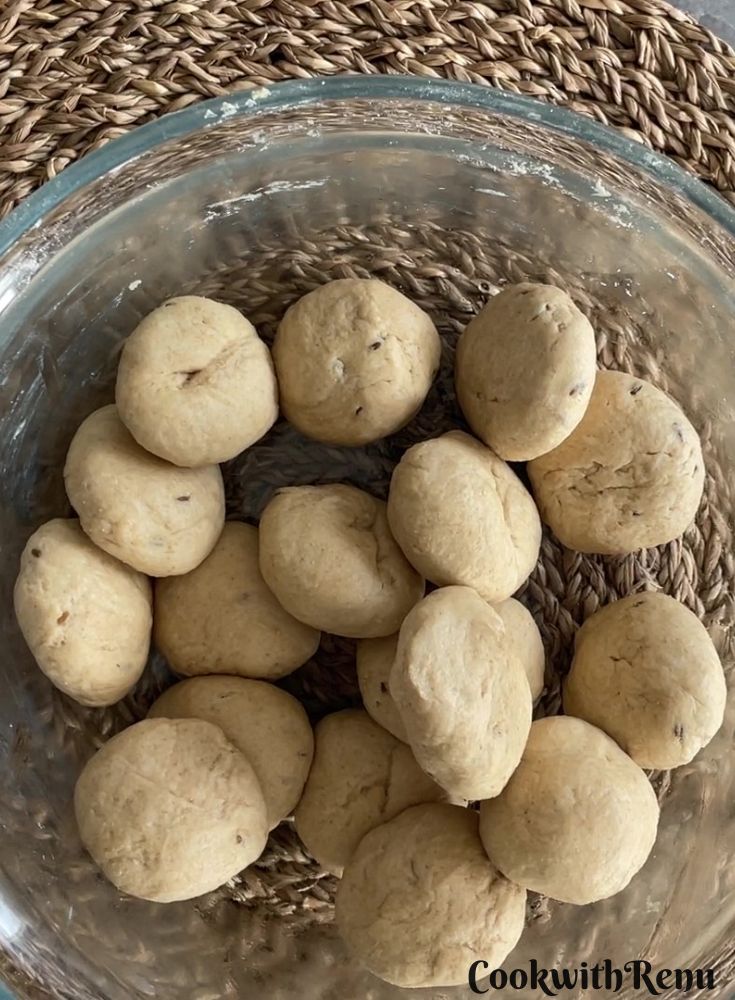 Flattening and smoothing dough to make puris