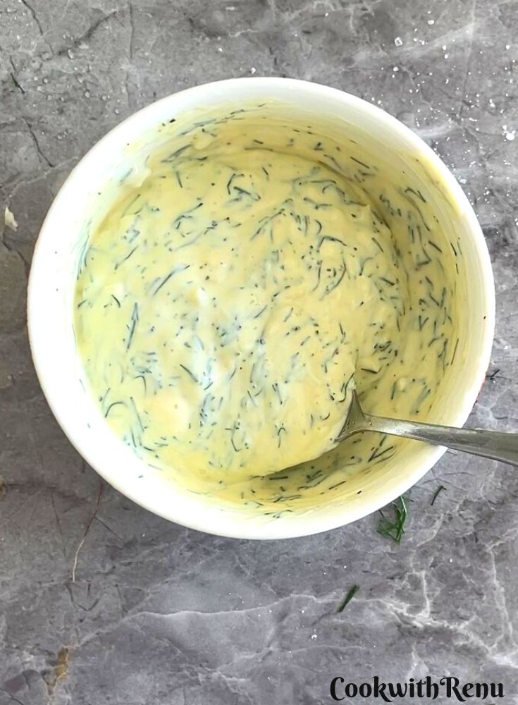 Prepared dressing for salad in a bowl.