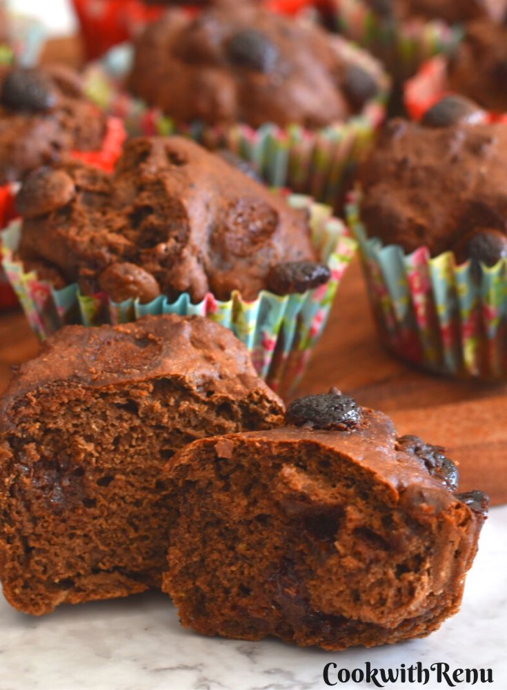 Close-up look of Avocado banana muffins showing the inside texture. Seen in the background are more muffins.