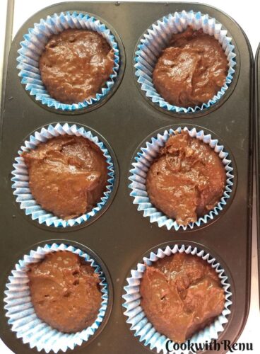 Whole Wheat Chocolate Avocado Banana Muffin ready to be baked in a muffin tin.