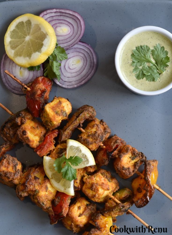 Paneer Tikka is a very popular Indian Style party appetizer made with cubes of tofu marinated in a yogurt and spice mixture. For Vegans, paneer can be replaced with tofu to make grilled vegan tofu tikka or skewers. 