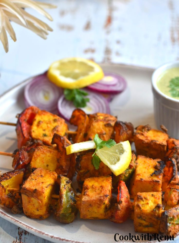 Tofu Tikka is a very popular Indian Style party appetizer made with cubes of tofu marinated in a yogurt and spice mixture. For Vegans, paneer can be replaced with tofu to make grilled vegan tofu tikka or skewers. 
