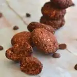 Close up texture of BeetRoot and Oats Cookies seen in the front, with a few cookies in the background.