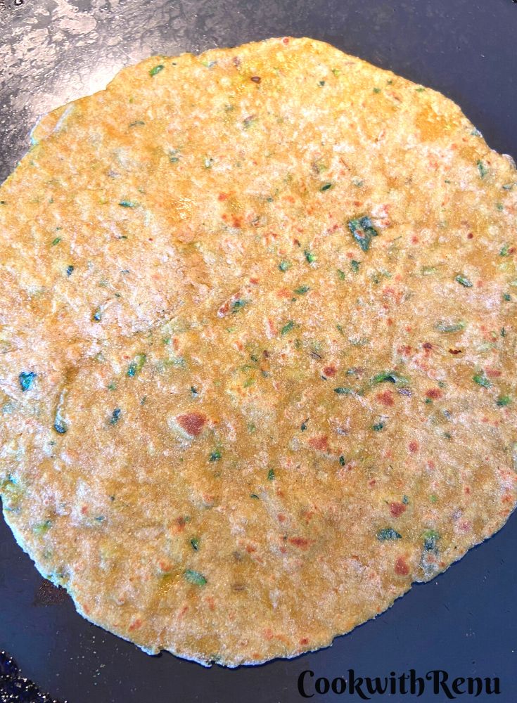 Cooking of Squash Paratha on the tava.