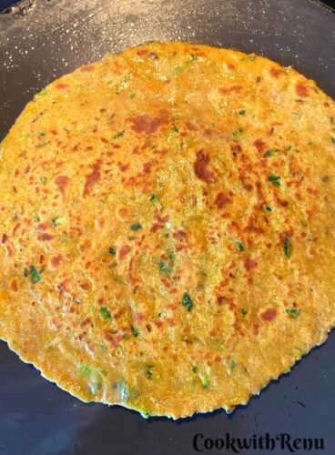 Cooking of Squash Paratha on the tava.
