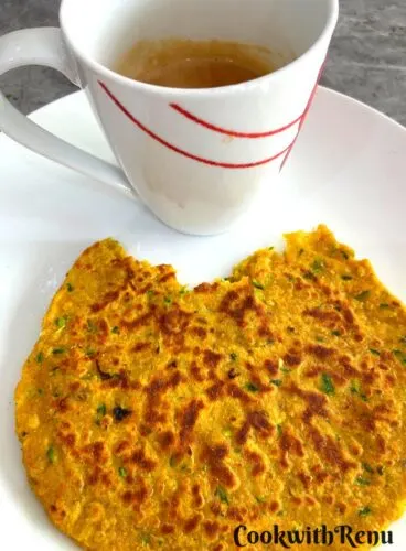 Courgette paratha with tea in a plate.