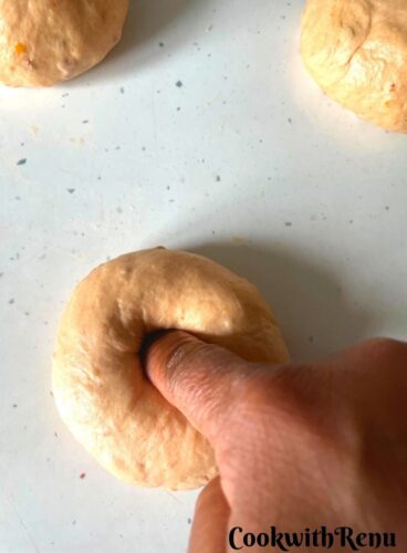 Dough getting shaped into Bagels.